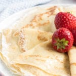 Folded crepes and strawberries.