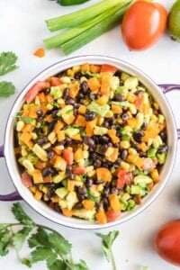 Black bean corn salsa in a purple serving dish.