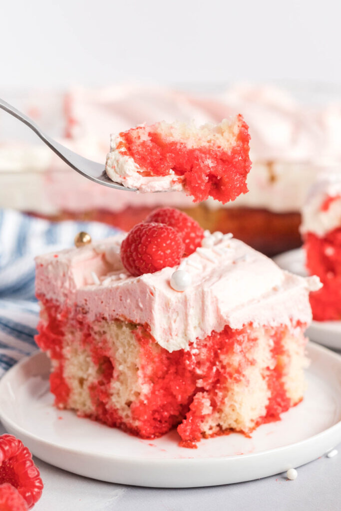 Raspberry Poke Cake Tastes of Homemade