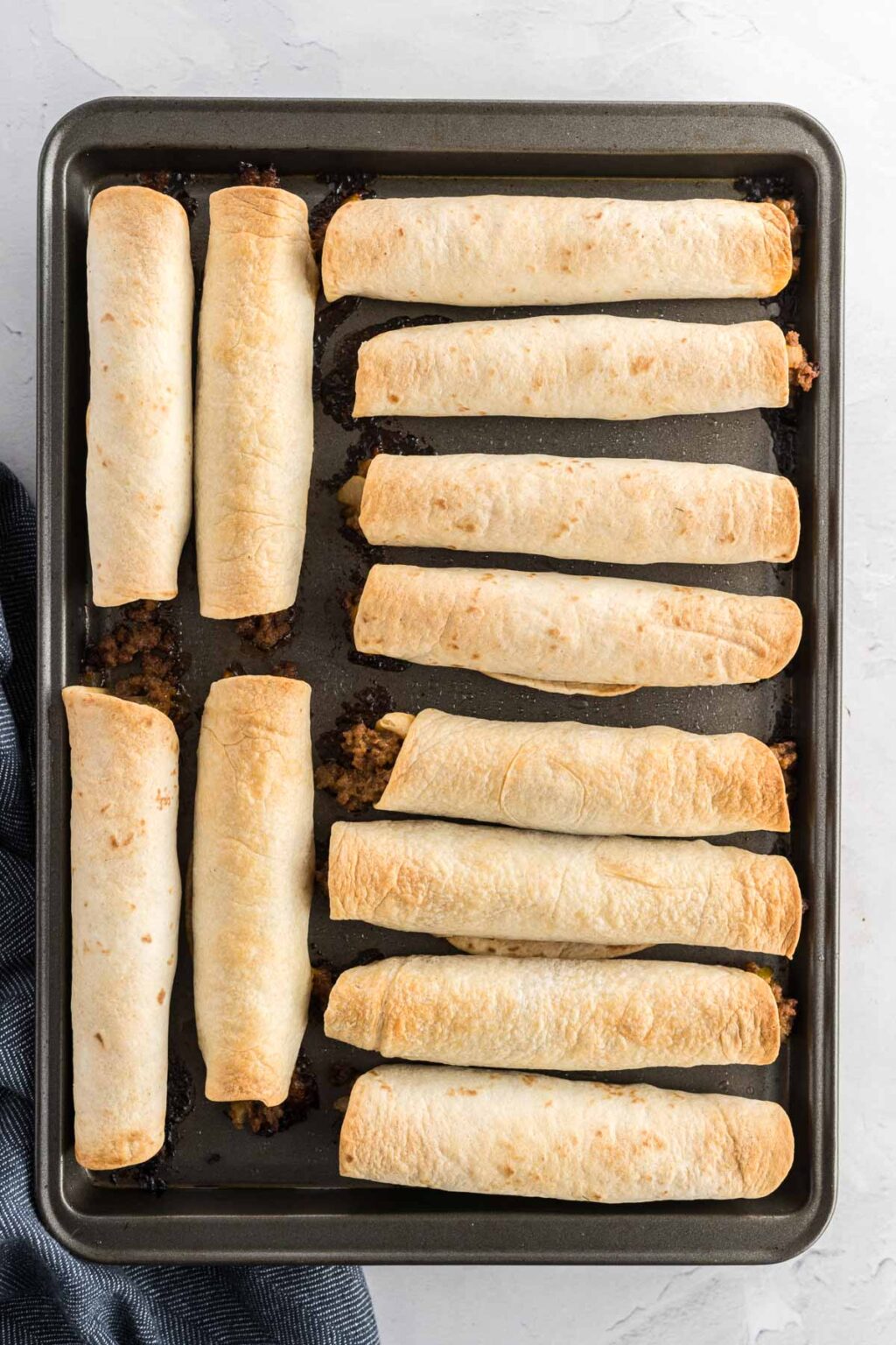 Baked Cheeseburger Taquitos Tastes of Homemade