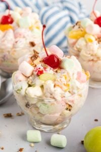 Three individual bowls of ambrosia salad.