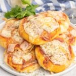 Mini pizzas on a plate.