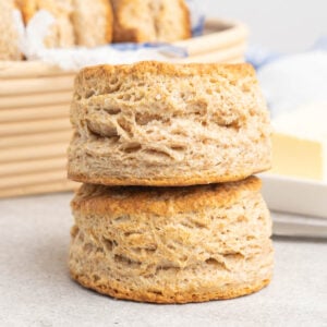Two whole wheat scones stacked on top of each other.