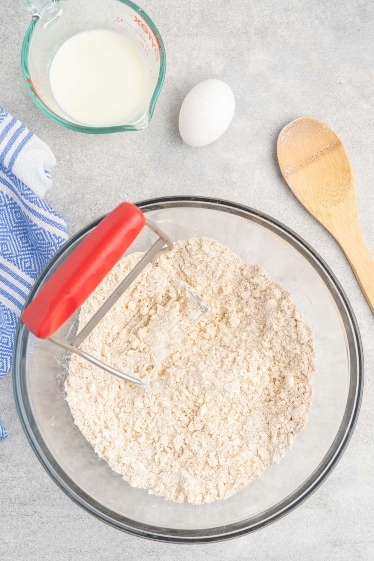 Whole wheat flour in a large mixing bowl with butter mixed in with a pastry blender.