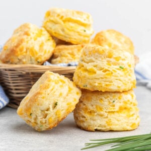 Cheddar chive biscuits in a basket.
