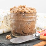 Cinnamon butter in a small mason jar with a spreader.