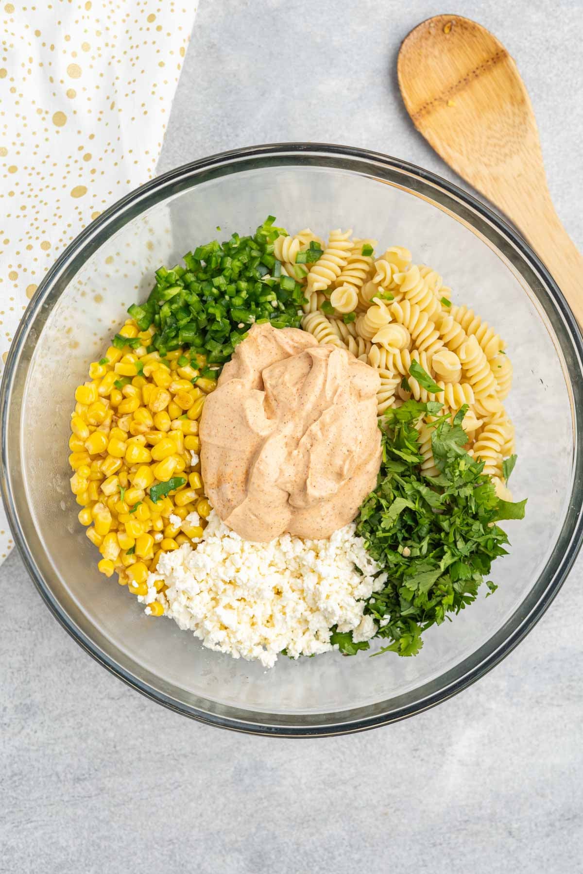 Ingredients for street corn pasta salad in a large mixing bowl. 