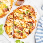BBQ chicken pizza on a plate.