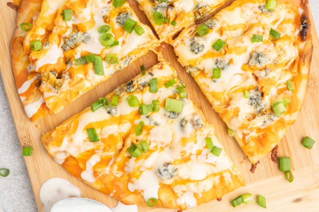 Flatbread with chicken, buffalo sauce and blue cheese.
