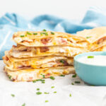 A stack of chicken bacon quesadillas.