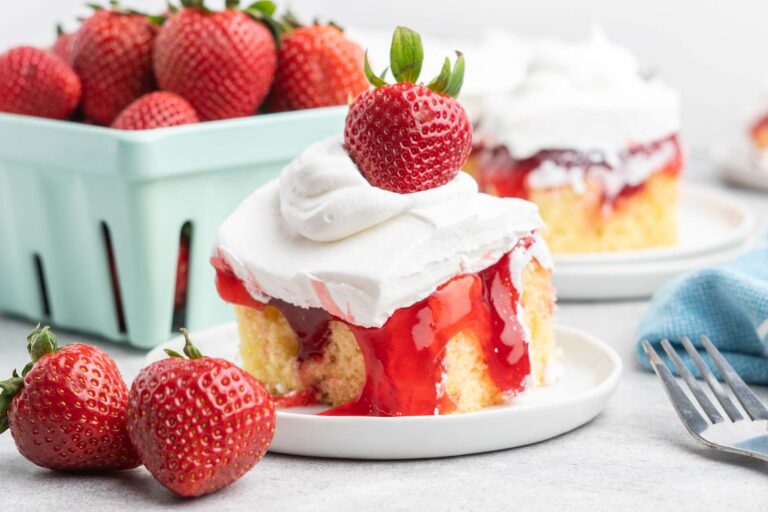 Yellow cake with strawberry filling and whipped cream.