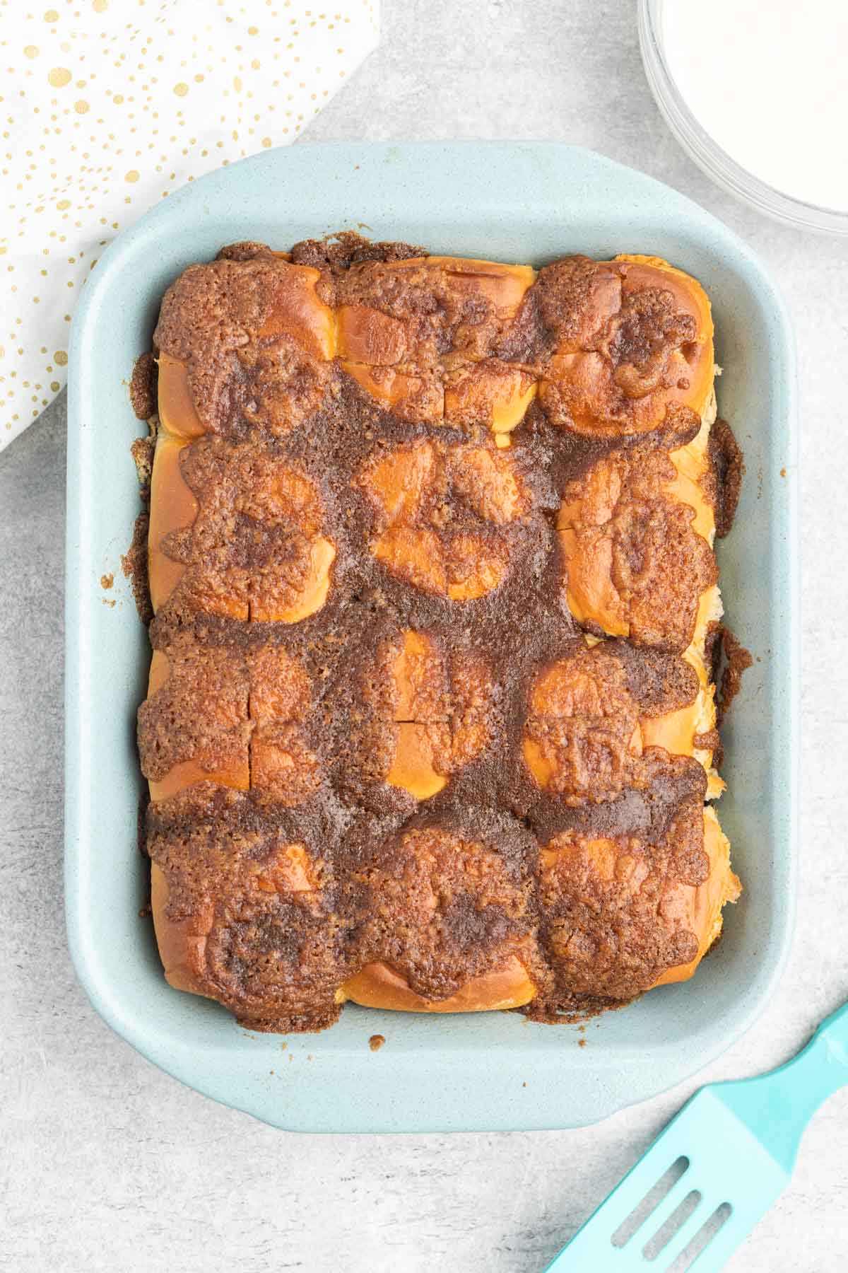 Baked hawaiian roll cinnamon rolls with melted cinnamon butter.