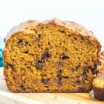 Chocolate chip pumpkin loaf on a cutting board.