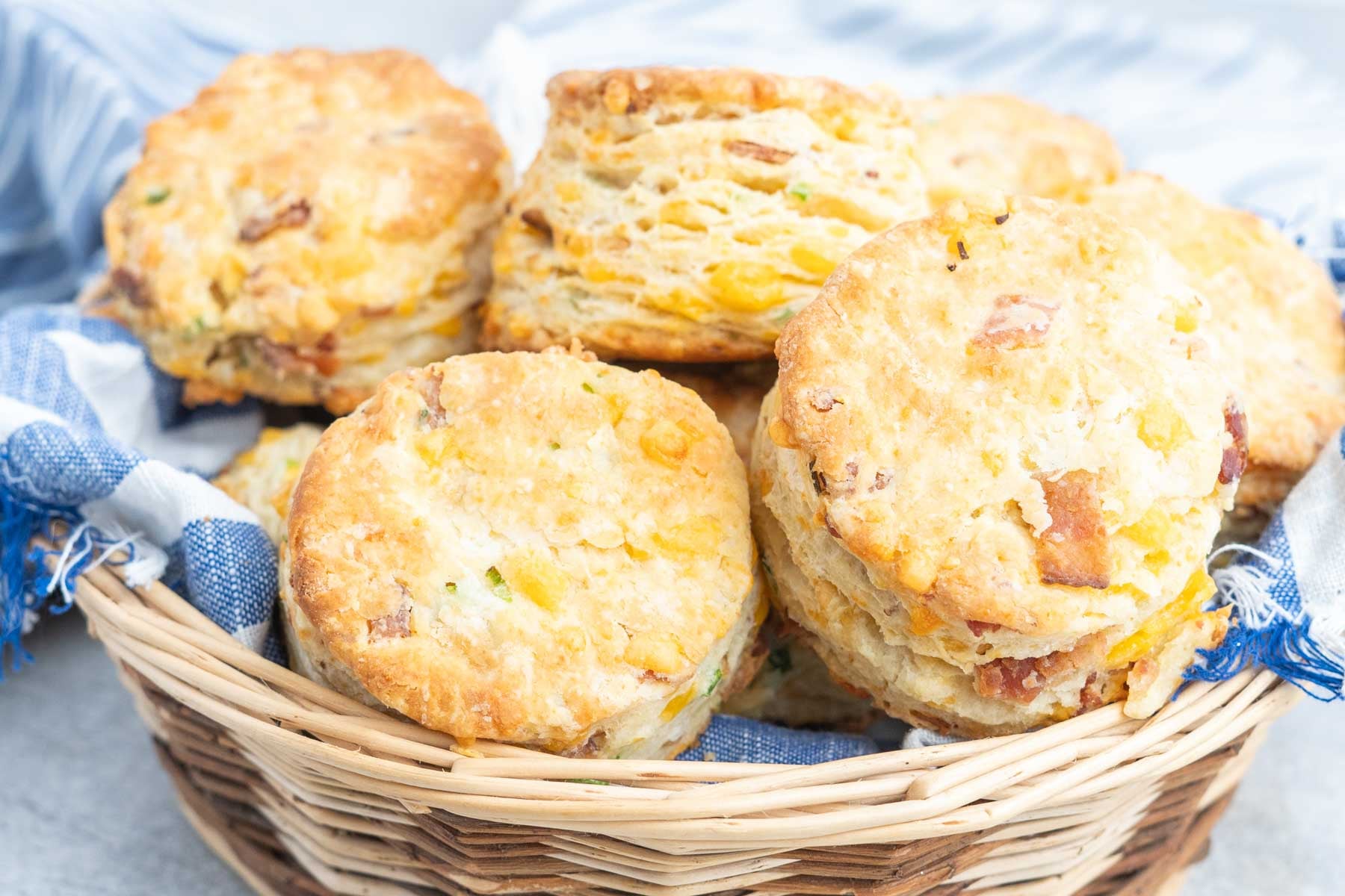 A basket of cheddar bacon biscuits.